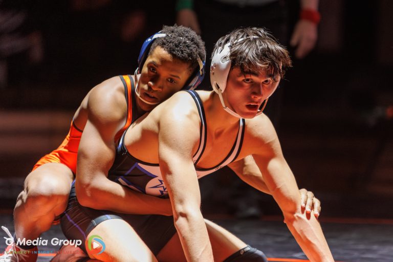 Isaac Lenard of the Saints wrestles North Stars’ Liam O’Brien.