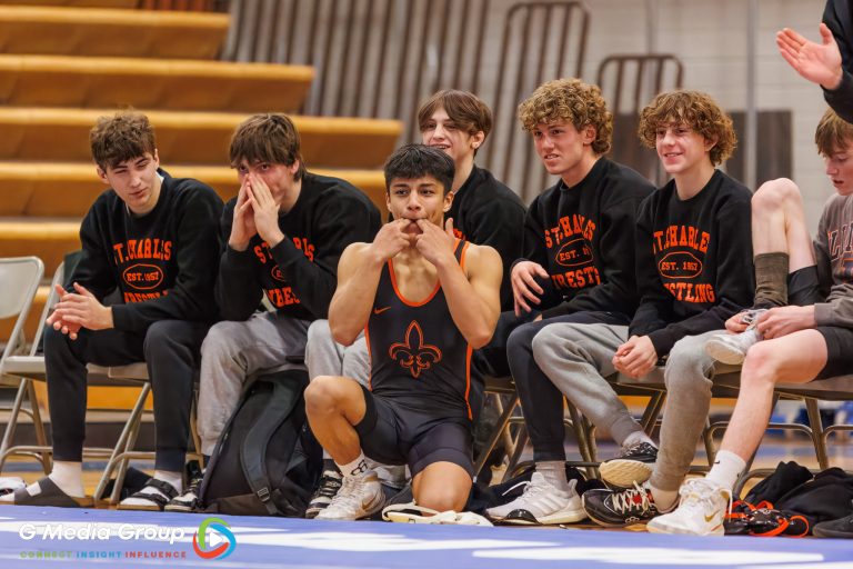 SCE Wrestlers cheer on SCE's Andrew Han during his match against Sam Sikorsky (Geneva) at Geneva Highschool on Jan 14, 2025.