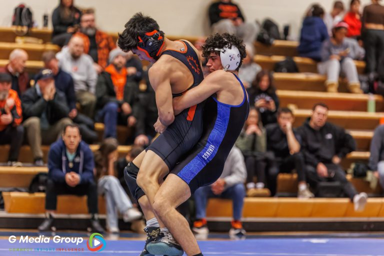 Ben Deasy (Geneva) lifts East's Payton Lee during his match on Jan 14, 2025 at Geneva High School.