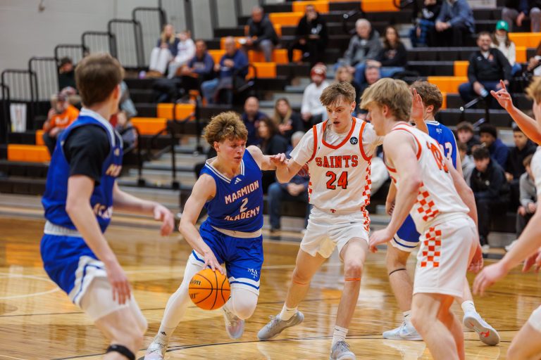 Marmion's Caden Anderson dribbles down the court during the game against SCE.