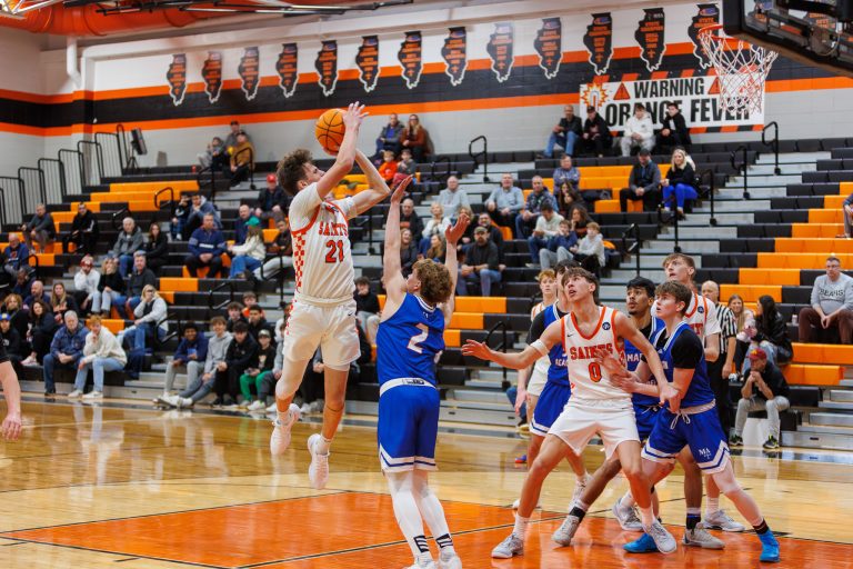 SCE's Marco Klebosits attempts a basket during the game against Marmion.