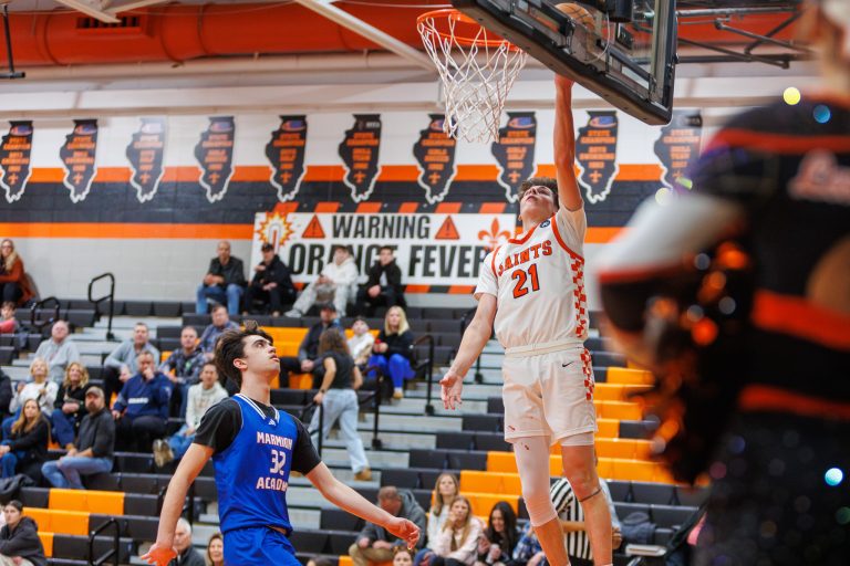 SCE's Marco Klebosits makes a basket during the game against Marmion.