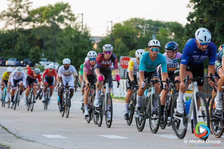 Cyclists compete during the Men’s Pro 1/2 race at the Winfield Criterium on Sunday, July 20, 2025, in Winfield, Ill. Multiple teams from around the world took part in the final race of the Winfield leg of the Chicago Grit series.