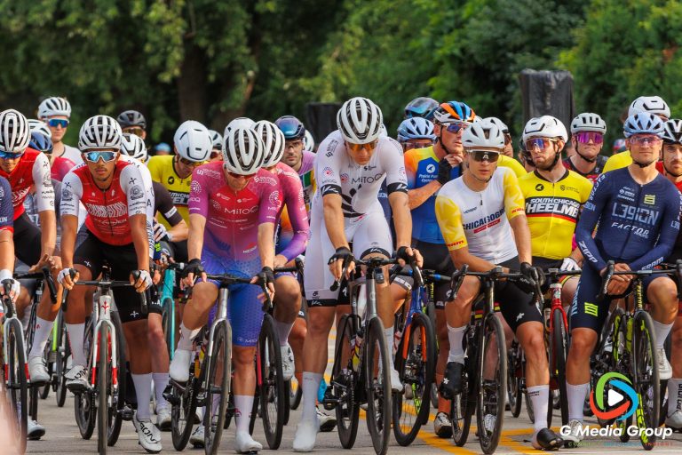 Riders line up at the starting line ahead of the Men’s Pro 1/2 race at the Winfield Criterium and Summerfest, Sunday, July 20, 2025, in Winfield, Ill. The race concluded the Winfield leg of the Chicago Grit criterium series.