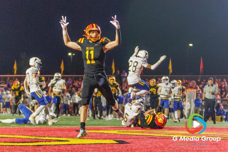 Batavia Senior Brett Berggren (#11) celebrates after a touchdown during the Batavia vs Wheaton North football game at Batavia Highschool on Oct 10, 2025. | Photo Credit: Zachary Gebis