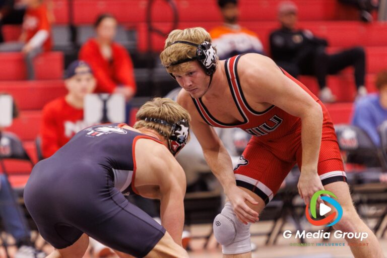 NIU's Brett Smith (Red) prepares to engage Colin Young (Black) during the 165-pound bout at the Red vs. Black Wrestle-Offs on Thursday, Oct. 30, 2025, in DeKalb, Ill. Young won the match by an 8-1 decision. | Photo Credit: Zachary Gebis