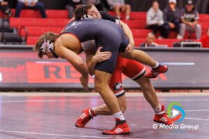 Spencer Mooberry (Red) battles Nathan Elstner (Black) in the 197-pound weight class at the NIU wrestle-offs. Mooberry won by Technical Fall (20-2). | Photo Credit: Zachary Gebis