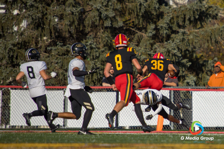 Batavia High School Senior Preston Brummel leaps into the endzone for a second-quarter touchdown, extending the Bulldogs' lead over Glenbard North, November 15, 2025. (Photo Credit - Zachary Gebis)
