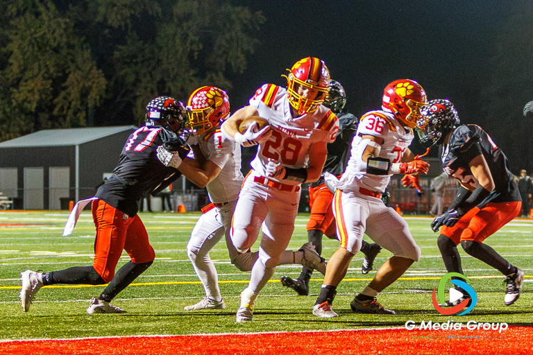 Batavia running back Henry Hahn (#28) scores his second touchdown of the night in the fourth quarter of the 42-21 victory over Glenbard East during the IHSA Class 7A Football Playoffs Second Round Game 19 on Friday, Nov. 7, 2025. | Photo: Zachary Gebis