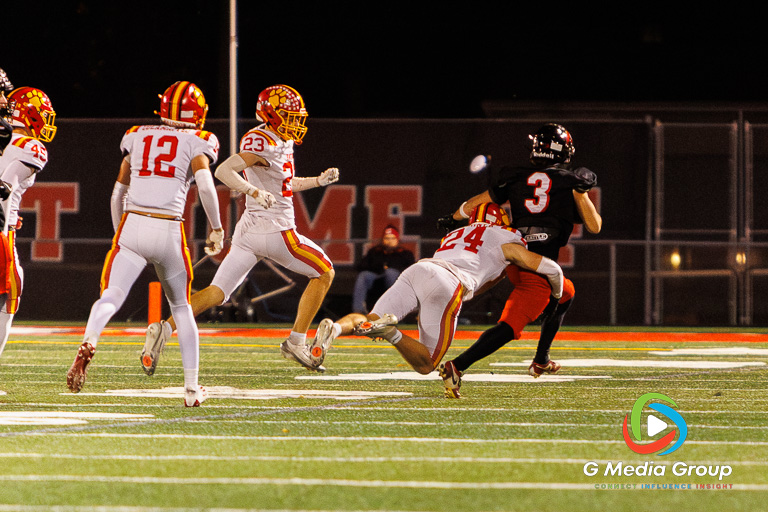 Glenbard East wide receiver Muhammad Musleh (#3) is tackled by Batavia safety Luke Gardner (#24) during the IHSA Class 7A Football Playoffs Second Round Game 19 on Friday, Nov. 7, 2025, in Lombard, IL. Batavia won 42-21. | Photo: Zachary Gebis