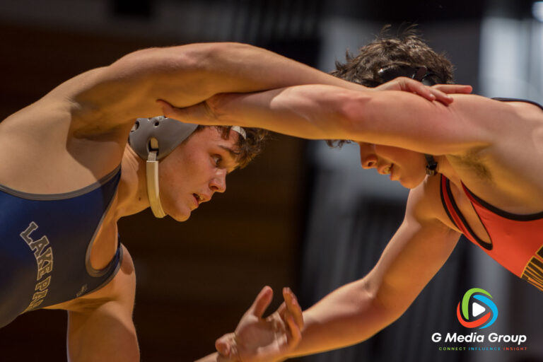 Lake Park High School's Alexander Gavrylyuk locks up with a Batavia High School opponent Sam Horne during a boys varsity wrestling dual meet in Batavia, Ill., on Thursday, Dec. 11, 2025. Gavrylyuk, competing at 190 lbs, secured a pin victory for the Lancers.