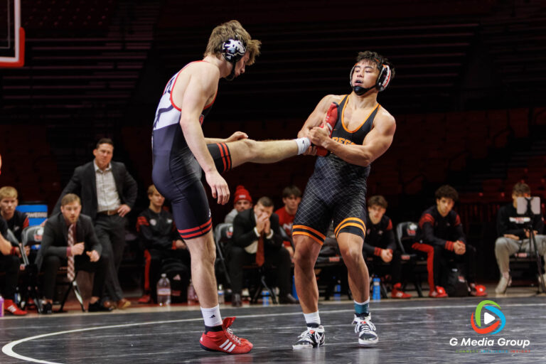 Noah Tolentino of Oregon State takes leg control of Lucan O'Brien (NIU) during the Match in DeKalb Illinois.