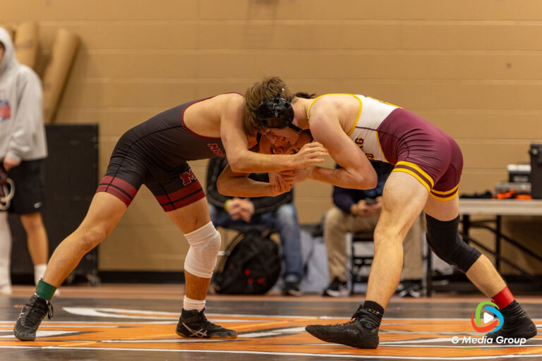 Moline's David McDermott and Luxemburg-Casco's Aaron Demeny wrestle during Day 1 of the 2025 Flavin Wrestling Tournament in DeKalb, IL on December 29, 2025.