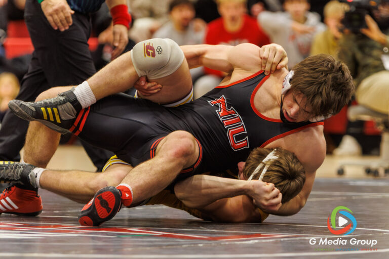 NIU's Tommy Bennett attempts a pin against CMU's Nick Marienfeld on January 16, 2026 in DeKalb, IL. Bennett won by decision 15-10. (Photo: Zachary Gebis)