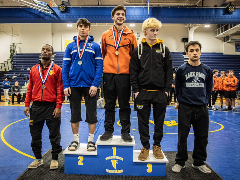 138 lbs Liam Aye (St. Charles East), Rocco Macellaio (Wheaton North), Trey Thompson (Glenbard North), Elias Chaney (Batavia), and Anthony Vargas (Lake Park) are honored during the championship round of the DuKane Conference Wrestling Championships held at Wheaton North on January 24, 2026.