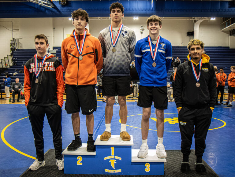144 lbs Nicholas Merola (Lake Park), Gavin Woodmancy (St. Charles East), Evan Madiol (Wheaton North), Joey Sirmon (Wheaton Warrenville South), and Xavier Morales (Glenbard North) pose for the cameras during the championship round of the DuKane Conference Wrestling Championships held at Wheaton North on January 24, 2026.