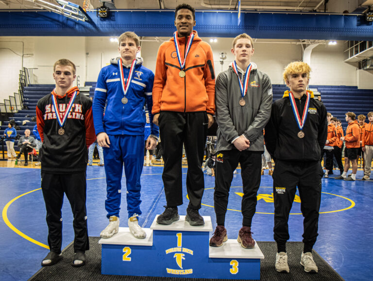 157 lbs Isaac Lenard (St. Charles East), Andrew Langas (Wheaton North), Cole Hubbard (Batavia), Noah Nau (Wheaton Warrenville South), and Marco Rafael (Glenbard North) pose during the championship round of the DuKane Conference Wrestling Championships held at Wheaton North on January 24, 2026.