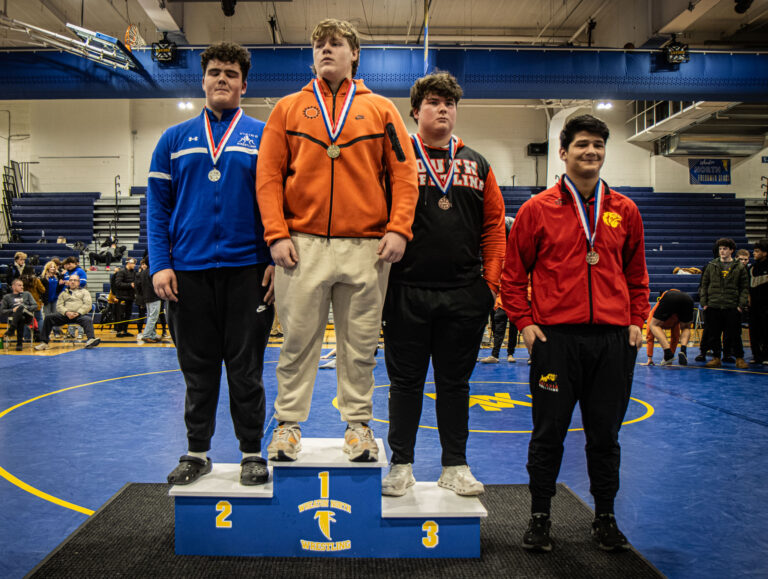285 lbs Matt Medina (St. Charles East), Mark Atkins (Geneva), Evan Vliek (Wheaton Warrenville South), Nick Tortoriello (Wheaton North), and Alex Linde-Marin (Batavia) stand on the final podium of the day during the championship round of the DuKane Conference Wrestling Championships held at Wheaton North on January 24, 2026.