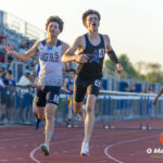 St. Charles North senior Brendan Byrne crosses the finish line just ahead of Lake Park's Wesley Bauernfreund to win Heat 2 of the Varsity Boys 300-meter hurdles at the DuKane Conference Championships on Friday, May 15, 2026. Byrne completed a sweep of the hurdles events with a winning time of 40.83 seconds, narrowly defeating Bauernfreund's 41.16 seconds.