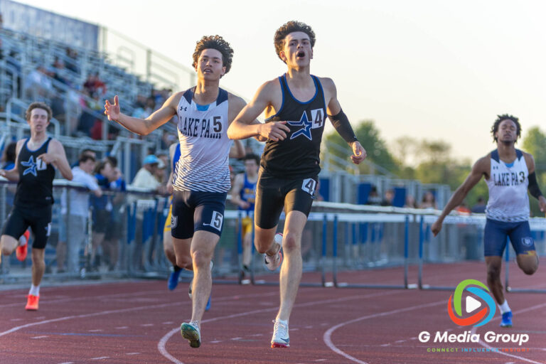 St. Charles North senior Brendan Byrne crosses the finish line just ahead of Lake Park's Wesley Bauernfreund to win Heat 2 of the Varsity Boys 300-meter hurdles at the DuKane Conference Championships on Friday, May 15, 2026. Byrne completed a sweep of the hurdles events with a winning time of 40.83 seconds, narrowly defeating Bauernfreund's 41.16 seconds.