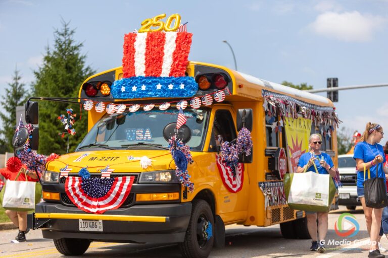 CAROL STREAM, Ill. — July 4, 2026: Participants march down the parade route during the annual Carol Stream Independence Day Parade in Carol Stream, Ill., Saturday, July 4, 2026. Despite a week-long regional heat wave, the community-funded tradition—a village staple since 1987—drew large crowds for the nearly two-hour event, which honored local military veterans as the collective Grand Marshal. (GMedia Group/Zachary Gebis)