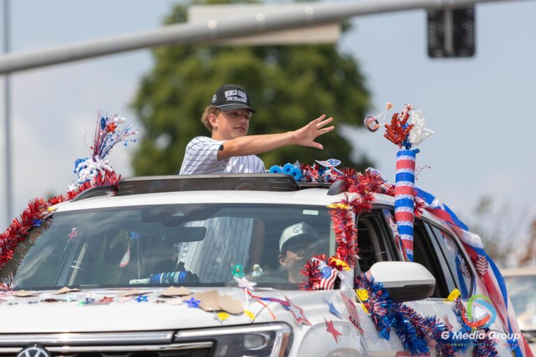 CAROL STREAM, Ill. — July 4, 2026: Participants march down the parade route during the annual Carol Stream Independence Day Parade in Carol Stream, Ill., Saturday, July 4, 2026. Despite a week-long regional heat wave, the community-funded tradition—a village staple since 1987—drew large crowds for the nearly two-hour event, which honored local military veterans as the collective Grand Marshal. (GMedia Group/Zachary Gebis)