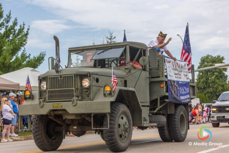 CAROL STREAM, Ill. — July 4, 2026: Participants march down the parade route during the annual Carol Stream Independence Day Parade in Carol Stream, Ill., Saturday, July 4, 2026. Despite a week-long regional heat wave, the community-funded tradition—a village staple since 1987—drew large crowds for the nearly two-hour event, which honored local military veterans as the collective Grand Marshal. (GMedia Group/Zachary Gebis)