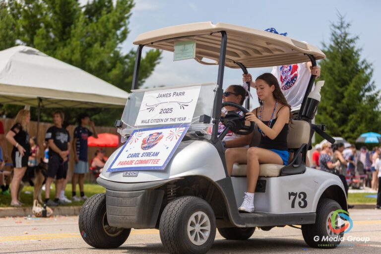 CAROL STREAM, Ill. — July 4, 2026: Participants march down the parade route during the annual Carol Stream Independence Day Parade in Carol Stream, Ill., Saturday, July 4, 2026. Despite a week-long regional heat wave, the community-funded tradition—a village staple since 1987—drew large crowds for the nearly two-hour event, which honored local military veterans as the collective Grand Marshal. (GMedia Group/Zachary Gebis)