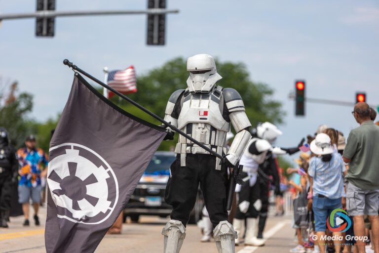 CAROL STREAM, Ill. — July 4, 2026: Participants march down the parade route during the annual Carol Stream Independence Day Parade in Carol Stream, Ill., Saturday, July 4, 2026. Despite a week-long regional heat wave, the community-funded tradition—a village staple since 1987—drew large crowds for the nearly two-hour event, which honored local military veterans as the collective Grand Marshal. (GMedia Group/Zachary Gebis)