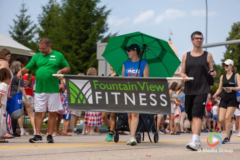 CAROL STREAM, Ill. — July 4, 2026: Participants march down the parade route during the annual Carol Stream Independence Day Parade in Carol Stream, Ill., Saturday, July 4, 2026. Despite a week-long regional heat wave, the community-funded tradition—a village staple since 1987—drew large crowds for the nearly two-hour event, which honored local military veterans as the collective Grand Marshal. (GMedia Group/Zachary Gebis)