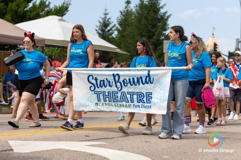 CAROL STREAM, Ill. — July 4, 2026: Participants march down the parade route during the annual Carol Stream Independence Day Parade in Carol Stream, Ill., Saturday, July 4, 2026. Despite a week-long regional heat wave, the community-funded tradition—a village staple since 1987—drew large crowds for the nearly two-hour event, which honored local military veterans as the collective Grand Marshal. (GMedia Group/Zachary Gebis)