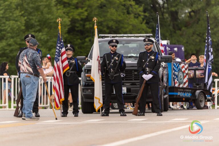 CAROL STREAM, Ill. — July 4, 2026: Participants march down the parade route during the annual Carol Stream Independence Day Parade in Carol Stream, Ill., Saturday, July 4, 2026. Despite a week-long regional heat wave, the community-funded tradition—a village staple since 1987—drew large crowds for the nearly two-hour event, which honored local military veterans as the collective Grand Marshal. (GMedia Group/Zachary Gebis)