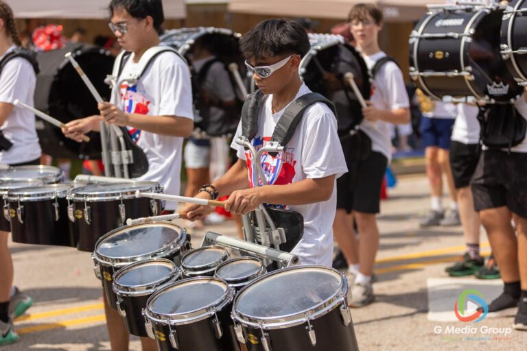 CAROL STREAM, Ill. — July 4, 2026: Participants march down the parade route during the annual Carol Stream Independence Day Parade in Carol Stream, Ill., Saturday, July 4, 2026. Despite a week-long regional heat wave, the community-funded tradition—a village staple since 1987—drew large crowds for the nearly two-hour event, which honored local military veterans as the collective Grand Marshal. (GMedia Group/Zachary Gebis)