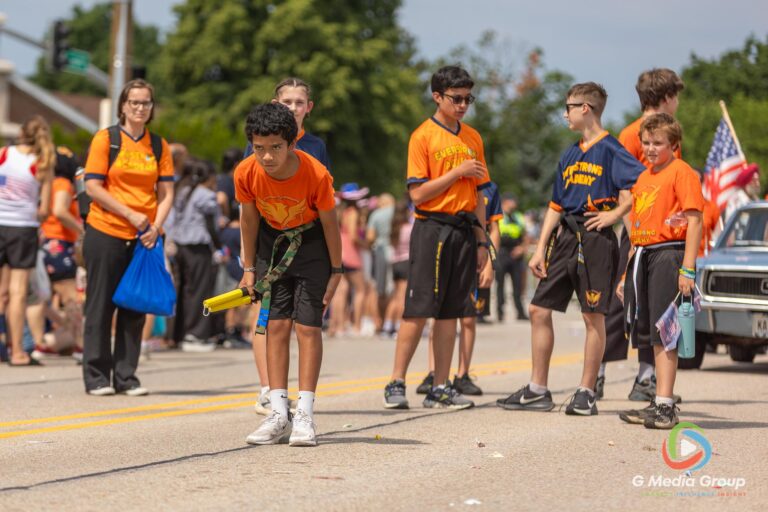 CAROL STREAM, Ill. — July 4, 2026: Participants march down the parade route during the annual Carol Stream Independence Day Parade in Carol Stream, Ill., Saturday, July 4, 2026. Despite a week-long regional heat wave, the community-funded tradition—a village staple since 1987—drew large crowds for the nearly two-hour event, which honored local military veterans as the collective Grand Marshal. (GMedia Group/Zachary Gebis)