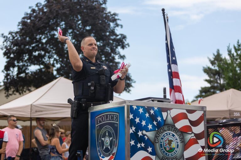 CAROL STREAM, Ill. — July 4, 2026: Participants march down the parade route during the annual Carol Stream Independence Day Parade in Carol Stream, Ill., Saturday, July 4, 2026. Despite a week-long regional heat wave, the community-funded tradition—a village staple since 1987—drew large crowds for the nearly two-hour event, which honored local military veterans as the collective Grand Marshal. (GMedia Group/Zachary Gebis)