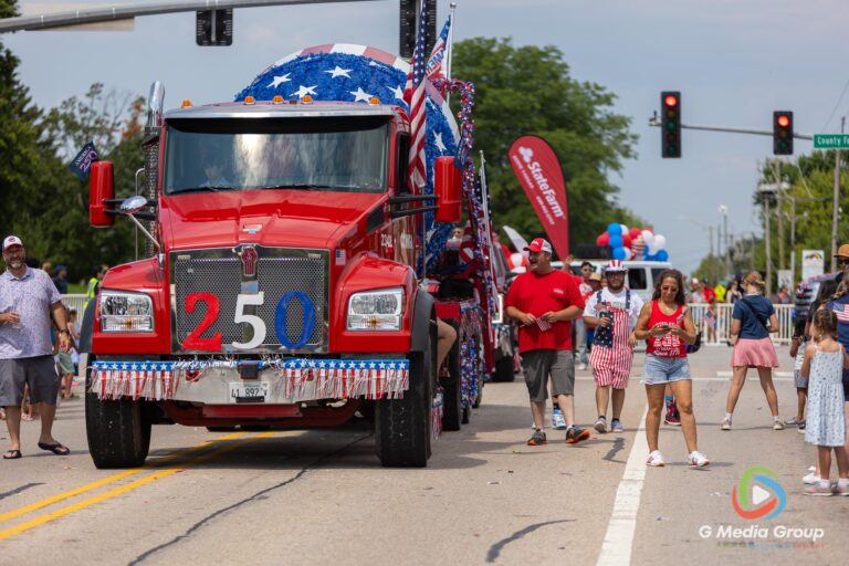 CAROL STREAM, Ill. — July 4, 2026: Participants march down the parade route during the annual Carol Stream Independence Day Parade in Carol Stream, Ill., Saturday, July 4, 2026. Despite a week-long regional heat wave, the community-funded tradition—a village staple since 1987—drew large crowds for the nearly two-hour event, which honored local military veterans as the collective Grand Marshal. (GMedia Group/Zachary Gebis)
