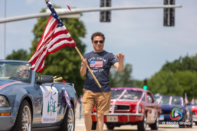 CAROL STREAM, Ill. — July 4, 2026: Participants march down the parade route during the annual Carol Stream Independence Day Parade in Carol Stream, Ill., Saturday, July 4, 2026. Despite a week-long regional heat wave, the community-funded tradition—a village staple since 1987—drew large crowds for the nearly two-hour event, which honored local military veterans as the collective Grand Marshal. (GMedia Group/Zachary Gebis)