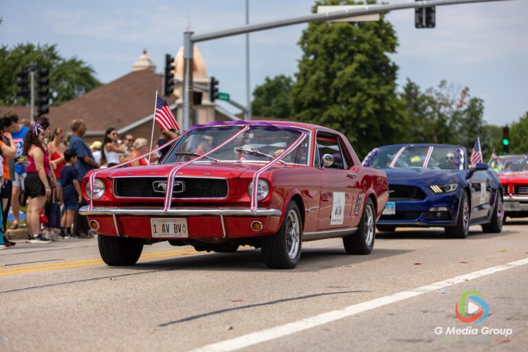 CAROL STREAM, Ill. — July 4, 2026: Participants march down the parade route during the annual Carol Stream Independence Day Parade in Carol Stream, Ill., Saturday, July 4, 2026. Despite a week-long regional heat wave, the community-funded tradition—a village staple since 1987—drew large crowds for the nearly two-hour event, which honored local military veterans as the collective Grand Marshal. (GMedia Group/Zachary Gebis)