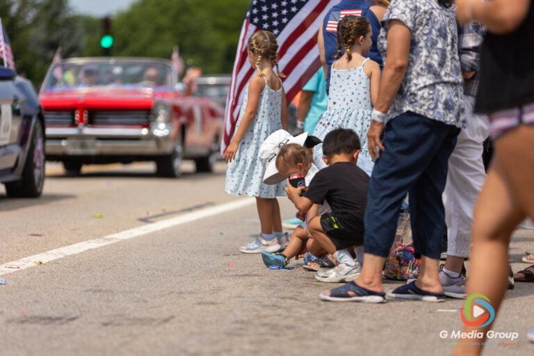 CAROL STREAM, Ill. — July 4, 2026: Participants march down the parade route during the annual Carol Stream Independence Day Parade in Carol Stream, Ill., Saturday, July 4, 2026. Despite a week-long regional heat wave, the community-funded tradition—a village staple since 1987—drew large crowds for the nearly two-hour event, which honored local military veterans as the collective Grand Marshal. (GMedia Group/Zachary Gebis)