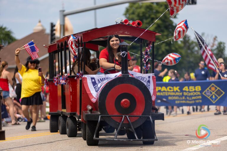 CAROL STREAM, Ill. — July 4, 2026: Participants march down the parade route during the annual Carol Stream Independence Day Parade in Carol Stream, Ill., Saturday, July 4, 2026. Despite a week-long regional heat wave, the community-funded tradition—a village staple since 1987—drew large crowds for the nearly two-hour event, which honored local military veterans as the collective Grand Marshal. (GMedia Group/Zachary Gebis)