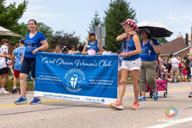 CAROL STREAM, Ill. — July 4, 2026: Participants march down the parade route during the annual Carol Stream Independence Day Parade in Carol Stream, Ill., Saturday, July 4, 2026. Despite a week-long regional heat wave, the community-funded tradition—a village staple since 1987—drew large crowds for the nearly two-hour event, which honored local military veterans as the collective Grand Marshal. (GMedia Group/Zachary Gebis)