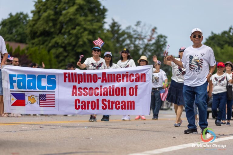 CAROL STREAM, Ill. — July 4, 2026: Participants march down the parade route during the annual Carol Stream Independence Day Parade in Carol Stream, Ill., Saturday, July 4, 2026. Despite a week-long regional heat wave, the community-funded tradition—a village staple since 1987—drew large crowds for the nearly two-hour event, which honored local military veterans as the collective Grand Marshal. (GMedia Group/Zachary Gebis)