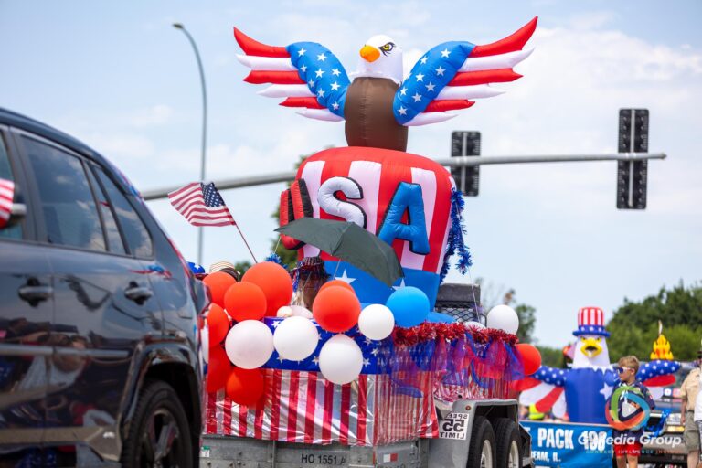 CAROL STREAM, Ill. — July 4, 2026: Participants march down the parade route during the annual Carol Stream Independence Day Parade in Carol Stream, Ill., Saturday, July 4, 2026. Despite a week-long regional heat wave, the community-funded tradition—a village staple since 1987—drew large crowds for the nearly two-hour event, which honored local military veterans as the collective Grand Marshal. (GMedia Group/Zachary Gebis)