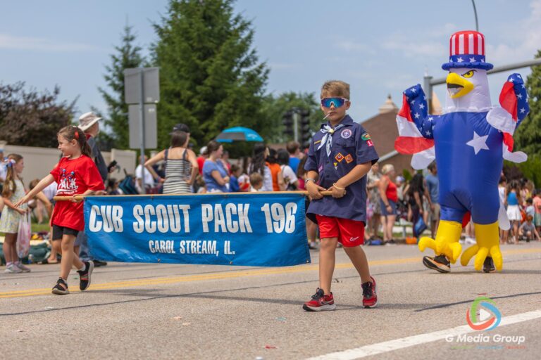 CAROL STREAM, Ill. — July 4, 2026: Participants march down the parade route during the annual Carol Stream Independence Day Parade in Carol Stream, Ill., Saturday, July 4, 2026. Despite a week-long regional heat wave, the community-funded tradition—a village staple since 1987—drew large crowds for the nearly two-hour event, which honored local military veterans as the collective Grand Marshal. (GMedia Group/Zachary Gebis)