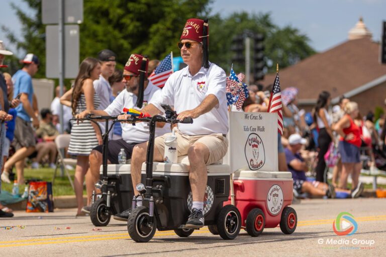 CAROL STREAM, Ill. — July 4, 2026: Participants march down the parade route during the annual Carol Stream Independence Day Parade in Carol Stream, Ill., Saturday, July 4, 2026. Despite a week-long regional heat wave, the community-funded tradition—a village staple since 1987—drew large crowds for the nearly two-hour event, which honored local military veterans as the collective Grand Marshal. (GMedia Group/Zachary Gebis)