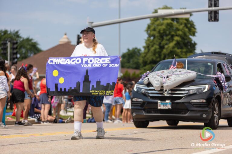 CAROL STREAM, Ill. — July 4, 2026: Participants march down the parade route during the annual Carol Stream Independence Day Parade in Carol Stream, Ill., Saturday, July 4, 2026. Despite a week-long regional heat wave, the community-funded tradition—a village staple since 1987—drew large crowds for the nearly two-hour event, which honored local military veterans as the collective Grand Marshal. (GMedia Group/Zachary Gebis)