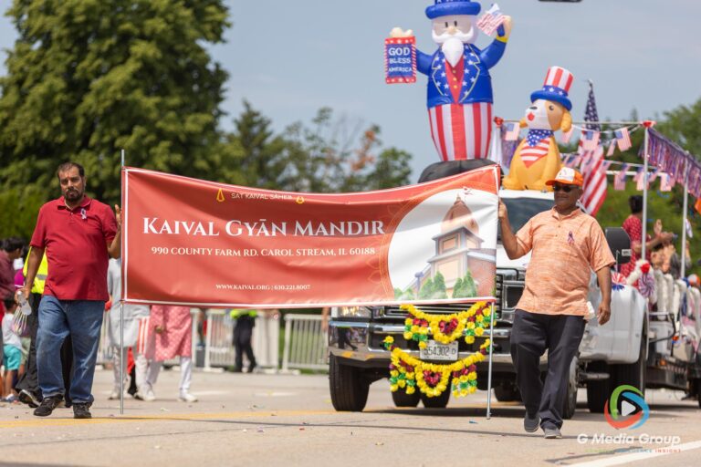 CAROL STREAM, Ill. — July 4, 2026: Participants march down the parade route during the annual Carol Stream Independence Day Parade in Carol Stream, Ill., Saturday, July 4, 2026. Despite a week-long regional heat wave, the community-funded tradition—a village staple since 1987—drew large crowds for the nearly two-hour event, which honored local military veterans as the collective Grand Marshal. (GMedia Group/Zachary Gebis)