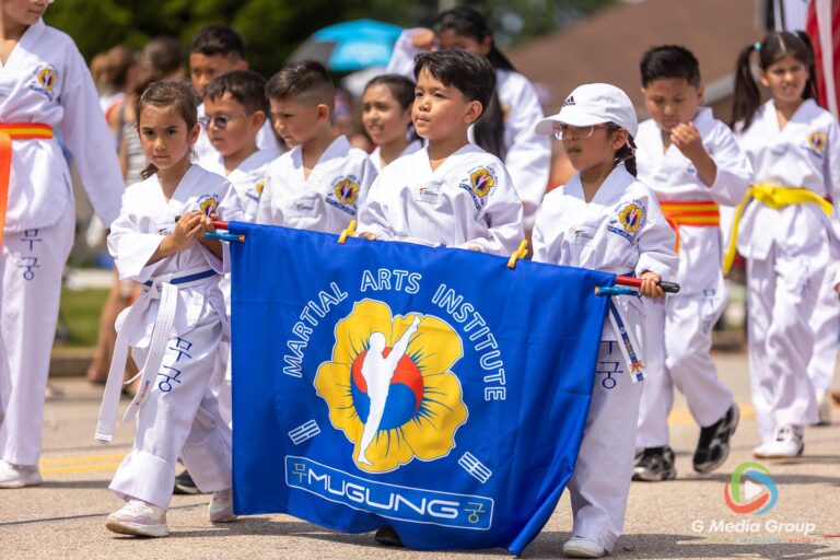 CAROL STREAM, Ill. — July 4, 2026: Participants march down the parade route during the annual Carol Stream Independence Day Parade in Carol Stream, Ill., Saturday, July 4, 2026. Despite a week-long regional heat wave, the community-funded tradition—a village staple since 1987—drew large crowds for the nearly two-hour event, which honored local military veterans as the collective Grand Marshal. (GMedia Group/Zachary Gebis)