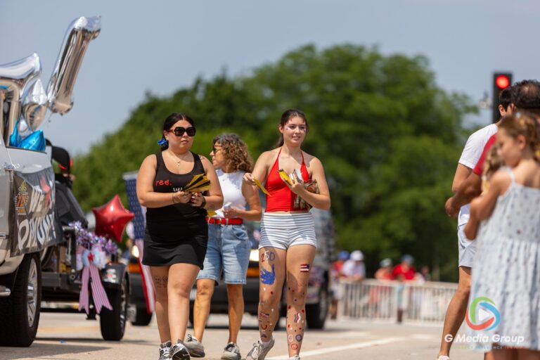 CAROL STREAM, Ill. — July 4, 2026: Participants march down the parade route during the annual Carol Stream Independence Day Parade in Carol Stream, Ill., Saturday, July 4, 2026. Despite a week-long regional heat wave, the community-funded tradition—a village staple since 1987—drew large crowds for the nearly two-hour event, which honored local military veterans as the collective Grand Marshal. (GMedia Group/Zachary Gebis)