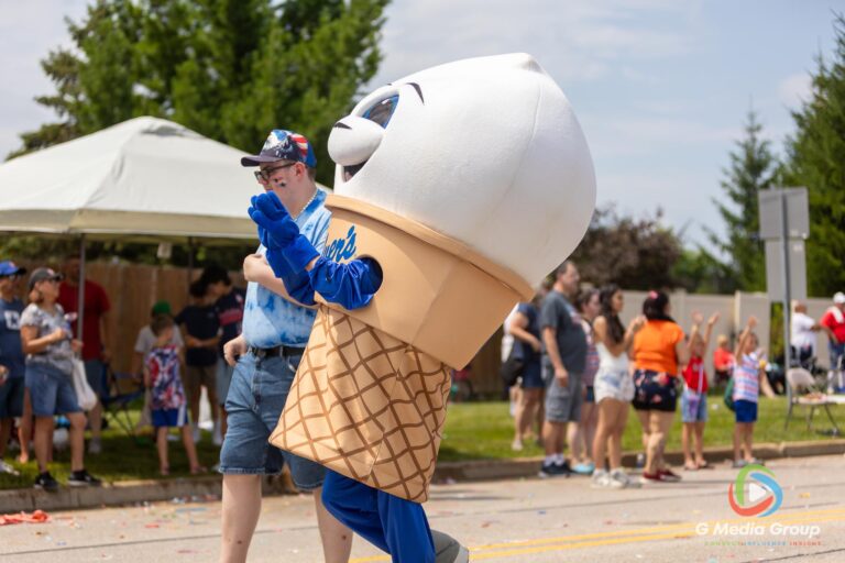 CAROL STREAM, Ill. — July 4, 2026: Participants march down the parade route during the annual Carol Stream Independence Day Parade in Carol Stream, Ill., Saturday, July 4, 2026. Despite a week-long regional heat wave, the community-funded tradition—a village staple since 1987—drew large crowds for the nearly two-hour event, which honored local military veterans as the collective Grand Marshal. (GMedia Group/Zachary Gebis)